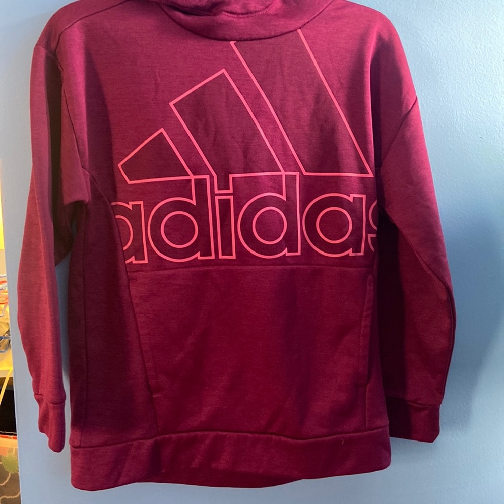 A pink Adidas sweatshirt
